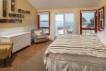 Master bedroom with a king bed and ocean views.